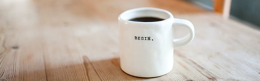 White coffee mug with the text "BEGIN" on it | Coor 